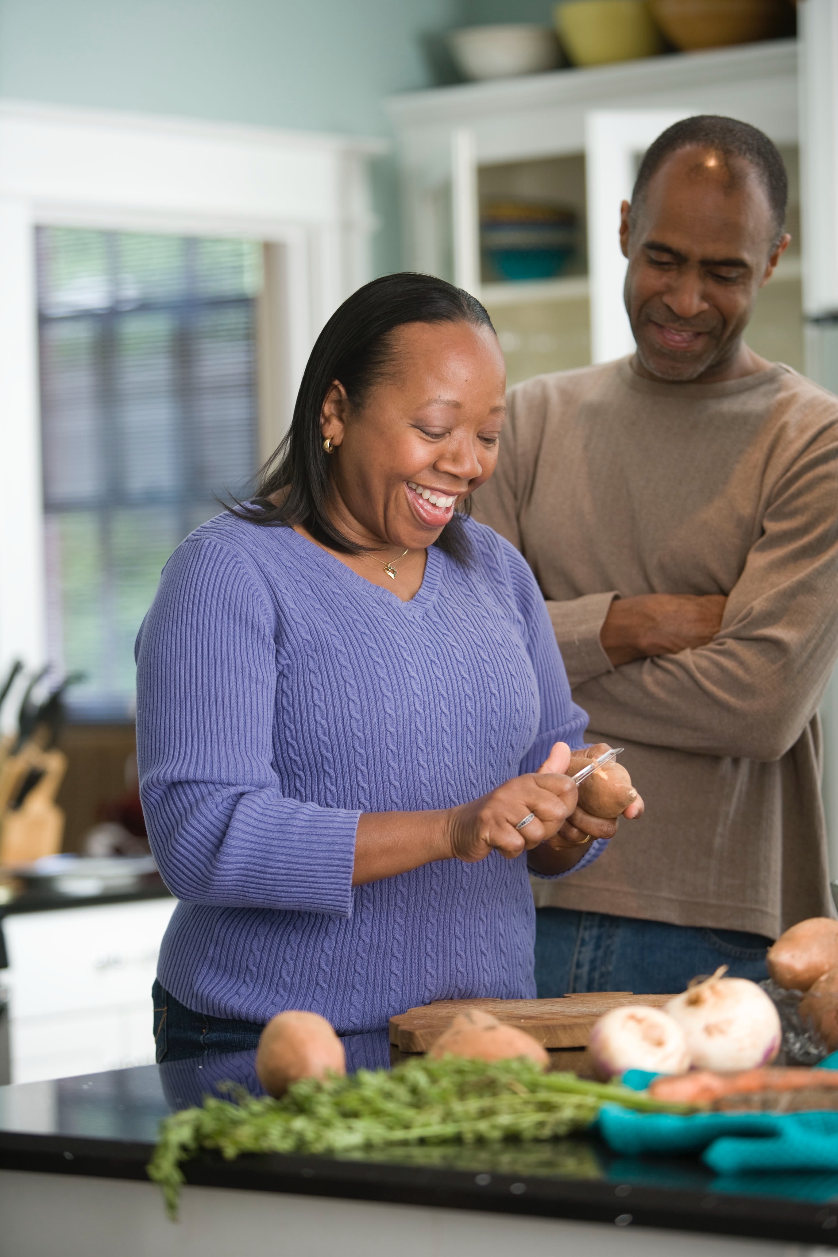 Lifestyle - Couple in kitchen cooking